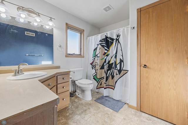 full bathroom with vanity, toilet, and curtained shower