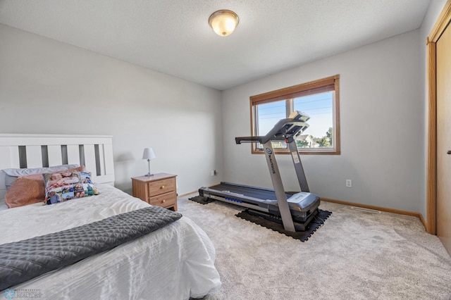 bedroom featuring carpet floors and baseboards