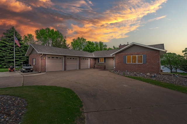 32355 Nottingham Ct, Chisago Lake Twp, MN 55045 - view of front of house featuring brick siding, a garage, concrete driveway, and a chimney