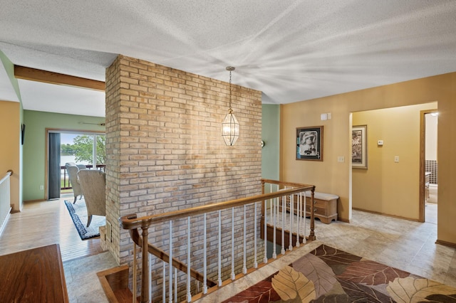 32355 Nottingham Ct, Chisago Lake Twp, MN 55045 - corridor with an upstairs landing, a textured ceiling, and baseboards