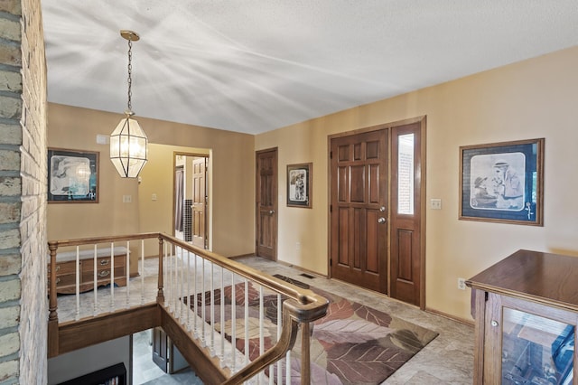 32355 Nottingham Ct, Chisago Lake Twp, MN 55045 - foyer entrance with a chandelier and baseboards