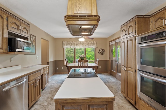 32355 Nottingham Ct, Chisago Lake Twp, MN 55045 - kitchen with appliances with stainless steel finishes, a center island, light countertops, and light carpet