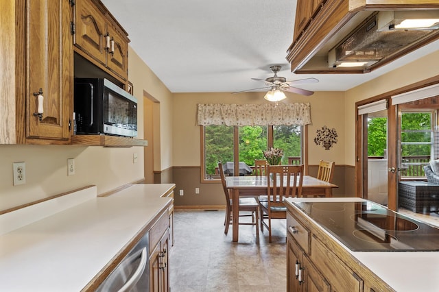 32355 Nottingham Ct, Chisago Lake Twp, MN 55045 - kitchen with black appliances, brown cabinets, ceiling fan, and light countertops