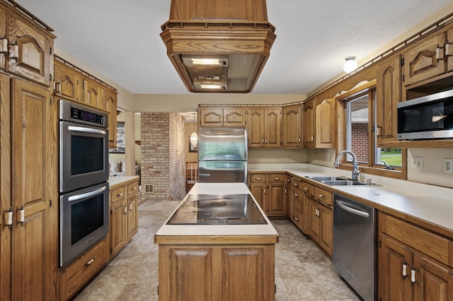 32355 Nottingham Ct, Chisago Lake Twp, MN 55045 - kitchen featuring stainless steel appliances, a sink, a center island, brown cabinets, and light countertops
