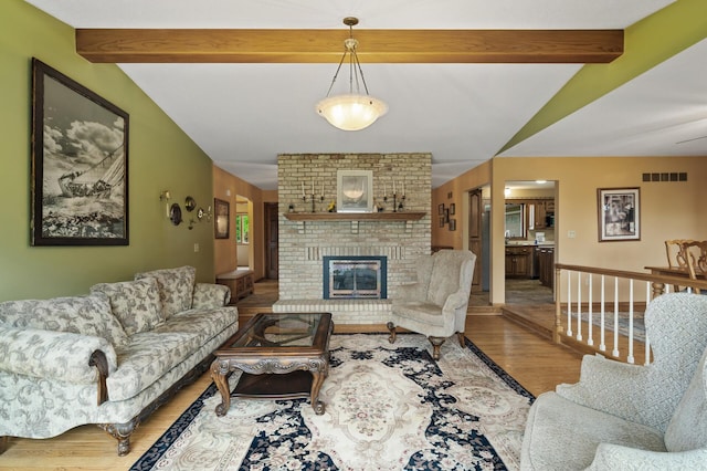32355 Nottingham Ct, Chisago Lake Twp, MN 55045 - living room with wood finished floors and a brick fireplace