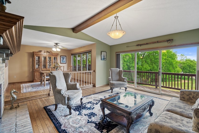 32355 Nottingham Ct, Chisago Lake Twp, MN 55045 - living area with hardwood / wood-style floors, a ceiling fan, and a fireplace