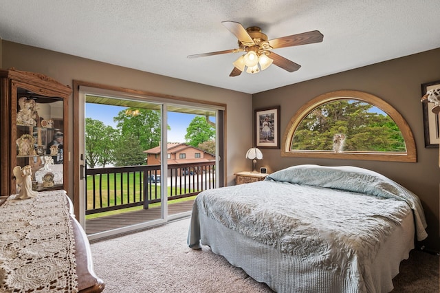 32355 Nottingham Ct, Chisago Lake Twp, MN 55045 - carpeted bedroom featuring access to outside, a textured ceiling, and ceiling fan