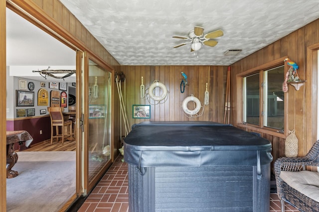 32355 Nottingham Ct, Chisago Lake Twp, MN 55045 - sunroom featuring a hot tub, pool table, wood walls, and brick patterned floors