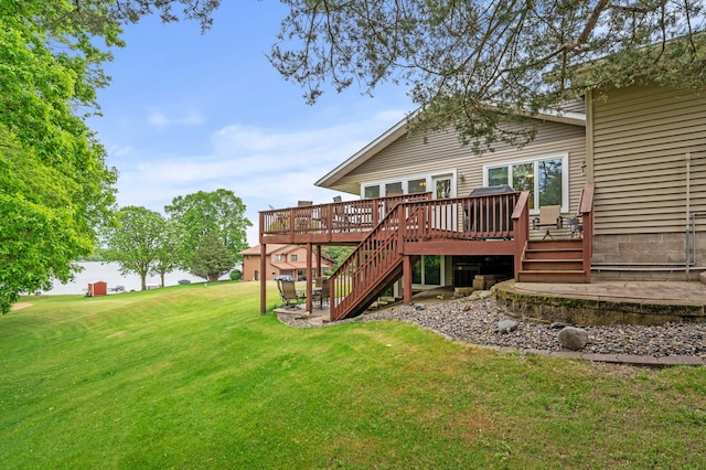 32355 Nottingham Ct, Chisago Lake Twp, MN 55045 - rear view of house with a deck, a lawn, and stairs