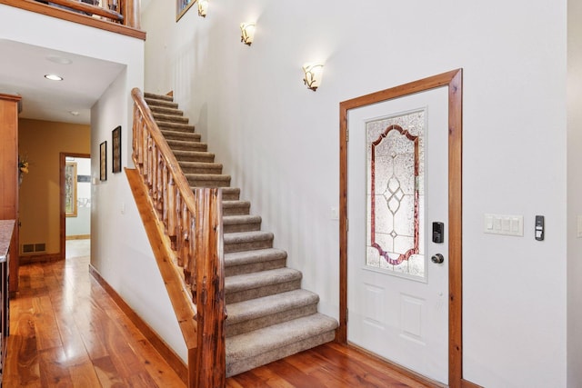 12640 Fawn Lake Rd, Crosslake, MN 56442 - entryway with stairway, wood finished floors, baseboards, and recessed lighting