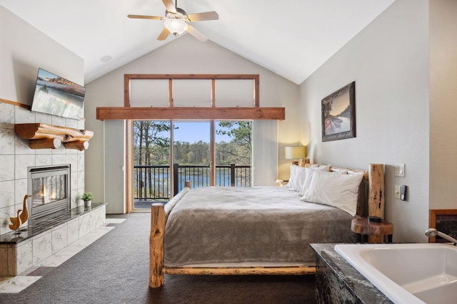 12640 Fawn Lake Rd, Crosslake, MN 56442 - carpeted bedroom with access to exterior, a tile fireplace, high vaulted ceiling, and ceiling fan