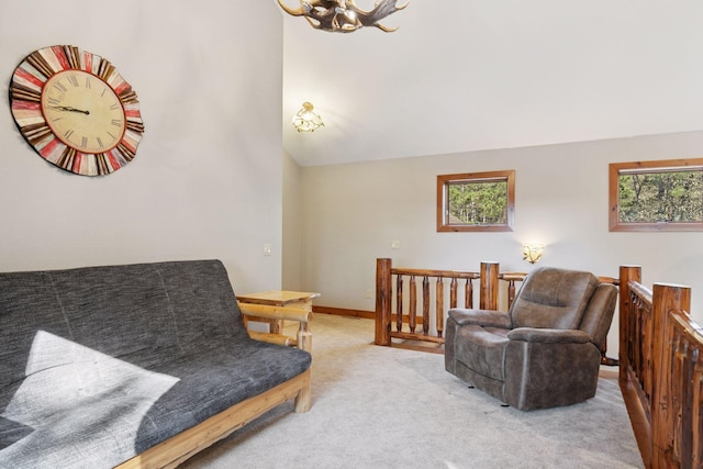 12640 Fawn Lake Rd, Crosslake, MN 56442 - living area with an upstairs landing, a chandelier, carpet floors, and vaulted ceiling