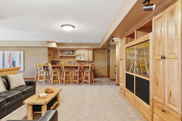 12640 Fawn Lake Rd, Crosslake, MN 56442 - living area with bar, light carpet, baseboards, and recessed lighting