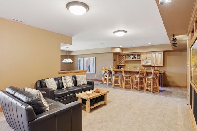 12640 Fawn Lake Rd, Crosslake, MN 56442 - living area with wet bar, light colored carpet, baseboards, and recessed lighting