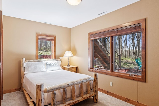 12640 Fawn Lake Rd, Crosslake, MN 56442 - carpeted bedroom featuring baseboards