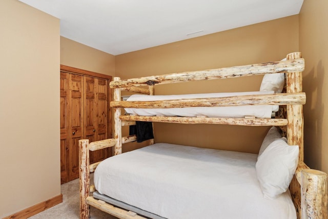 12640 Fawn Lake Rd, Crosslake, MN 56442 - bedroom featuring light carpet, baseboards, and a closet