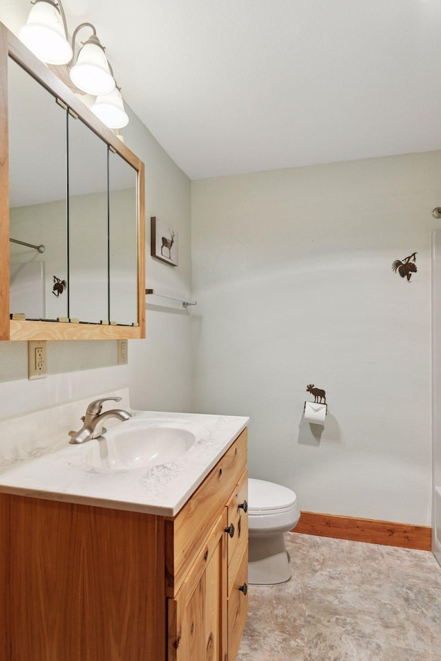 12640 Fawn Lake Rd, Crosslake, MN 56442 - full bathroom featuring vanity, a shower, toilet, and baseboards