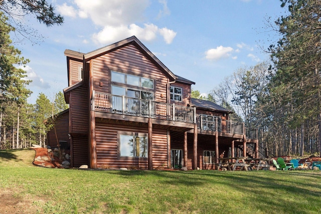 12640 Fawn Lake Rd, Crosslake, MN 56442 - back of property with a deck, a lawn, stairs, and log veneer siding