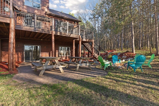 12640 Fawn Lake Rd, Crosslake, MN 56442 - back of property with a patio, a deck, stairs, and a yard