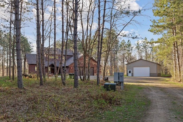 12640 Fawn Lake Rd, Crosslake, MN 56442 - view of front of home with a detached garage, an outdoor structure, and driveway