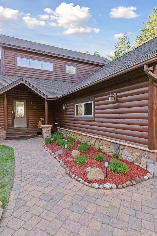 12640 Fawn Lake Rd, Crosslake, MN 56442 - view of front of home with roof with shingles and covered porch
