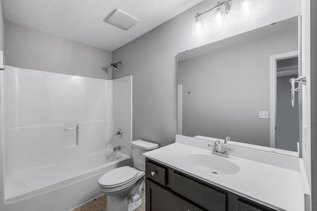 full bath with a textured ceiling, toilet, shower / washtub combination, and vanity
