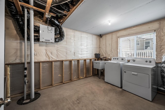 clothes washing area with separate washer and dryer