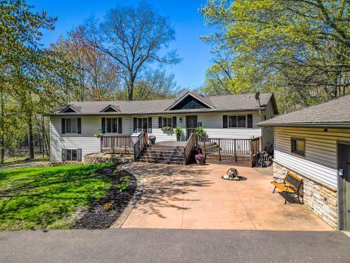 ranch-style home with a wooden deck