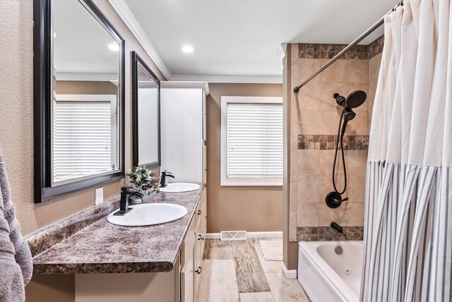 full bathroom with shower / tub combo with curtain, wood finished floors, ornamental molding, double vanity, and baseboards