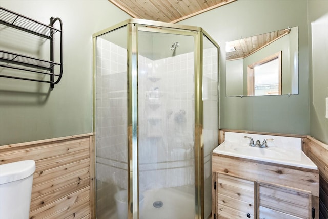 full bath featuring a stall shower, vanity, toilet, and wood ceiling