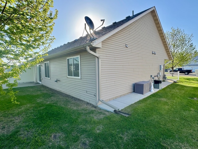 view of property exterior featuring a lawn