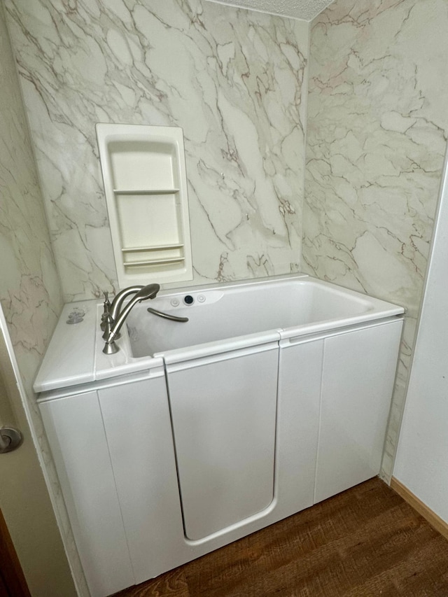 full bathroom with a bath