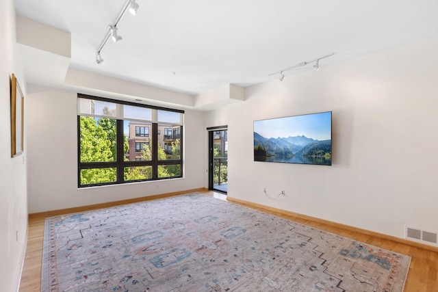 3709 Grand Way Unit 315, Saint Louis Park, MN 55416 - unfurnished room with track lighting, wood finished floors, and baseboards