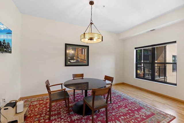 3709 Grand Way Unit 315, Saint Louis Park, MN 55416 - dining space featuring wood finished floors and baseboards