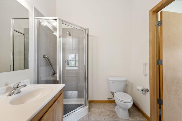 3709 Grand Way Unit 315, Saint Louis Park, MN 55416 - bathroom featuring a stall shower, toilet, tile patterned floors, and baseboards