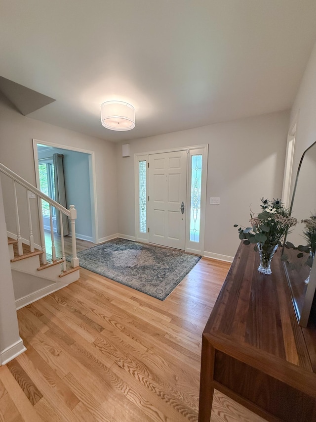 14700 Minnehaha Pl, Minnetonka, MN 55391 - foyer with wood finished floors, baseboards, and stairway