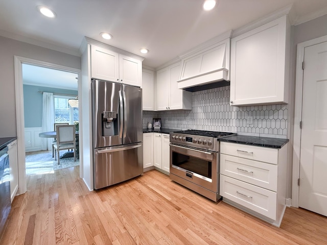 14700 Minnehaha Pl, Minnetonka, MN 55391 - kitchen featuring stainless steel appliances, ornamental molding, white cabinetry, backsplash, and custom range hood