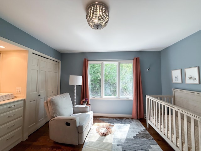 14700 Minnehaha Pl, Minnetonka, MN 55391 - bedroom with dark wood-style flooring, a closet, and a crib