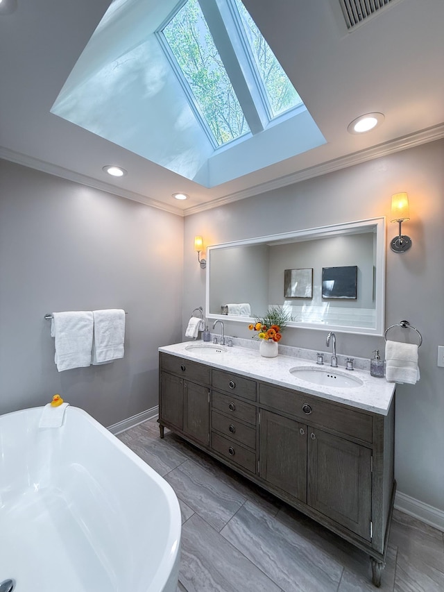 14700 Minnehaha Pl, Minnetonka, MN 55391 - full bath with a skylight, double vanity, a freestanding tub, baseboards, and recessed lighting