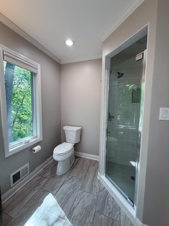 14700 Minnehaha Pl, Minnetonka, MN 55391 - bathroom with a stall shower, toilet, crown molding, baseboards, and recessed lighting