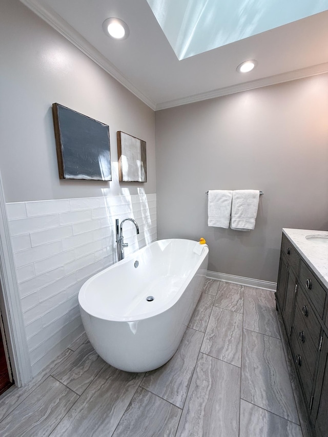 14700 Minnehaha Pl, Minnetonka, MN 55391 - full bathroom featuring a soaking tub, tile walls, ornamental molding, vanity, and recessed lighting
