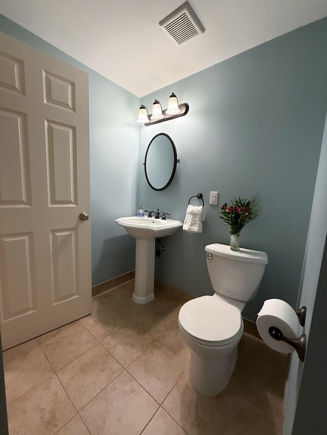 14700 Minnehaha Pl, Minnetonka, MN 55391 - half bath with tile patterned flooring, toilet, and baseboards