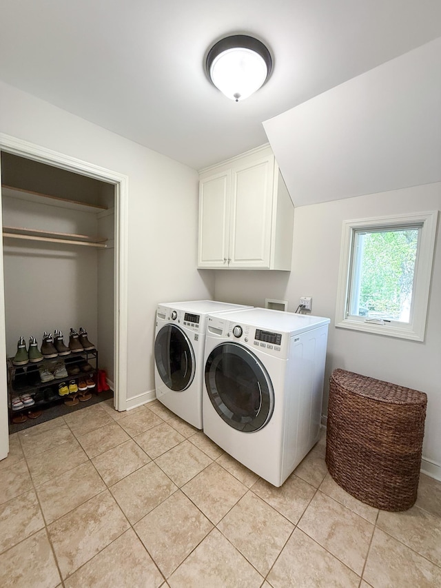 14700 Minnehaha Pl, Minnetonka, MN 55391 - laundry area with cabinet space, washer and dryer, light tile patterned floors, and baseboards