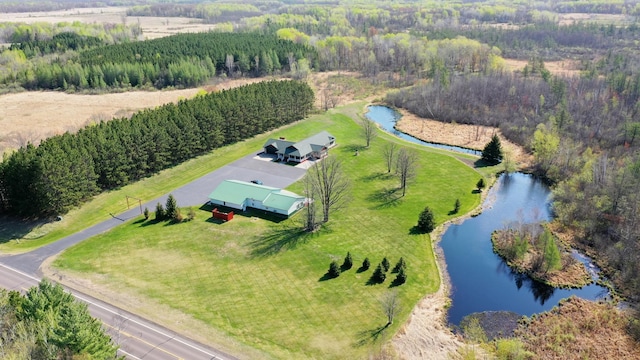 aerial view of sparsely populated area with a large body of water