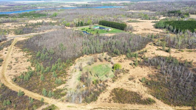 aerial view of property's location with rural landscape and a large body of water