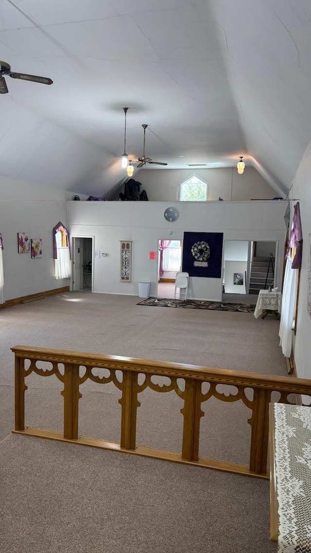 211 1st Ave, Osakis, MN 56360 - living area with ceiling fan, carpet flooring, and vaulted ceiling