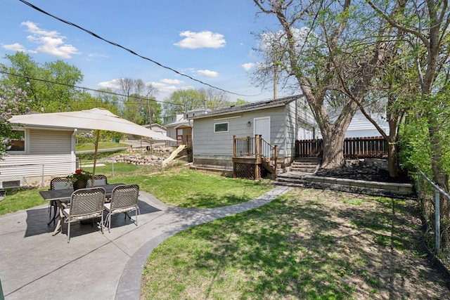 rear view of house with a patio and outdoor dining space