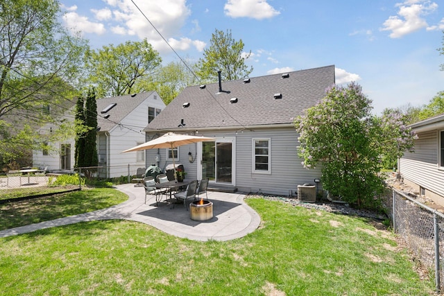 rear view of property featuring a patio and central AC