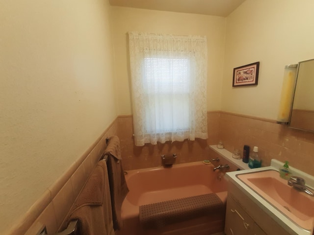 101 8th Ave N, Saint James, MN 56081 - full bathroom featuring vanity, a garden tub, and tile walls