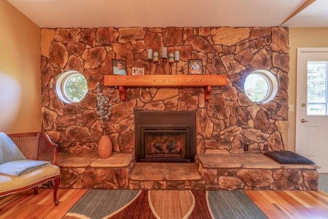 402 2nd Ave SE, Mapleton, MN 56065 - living room featuring wood finished floors and a stone fireplace